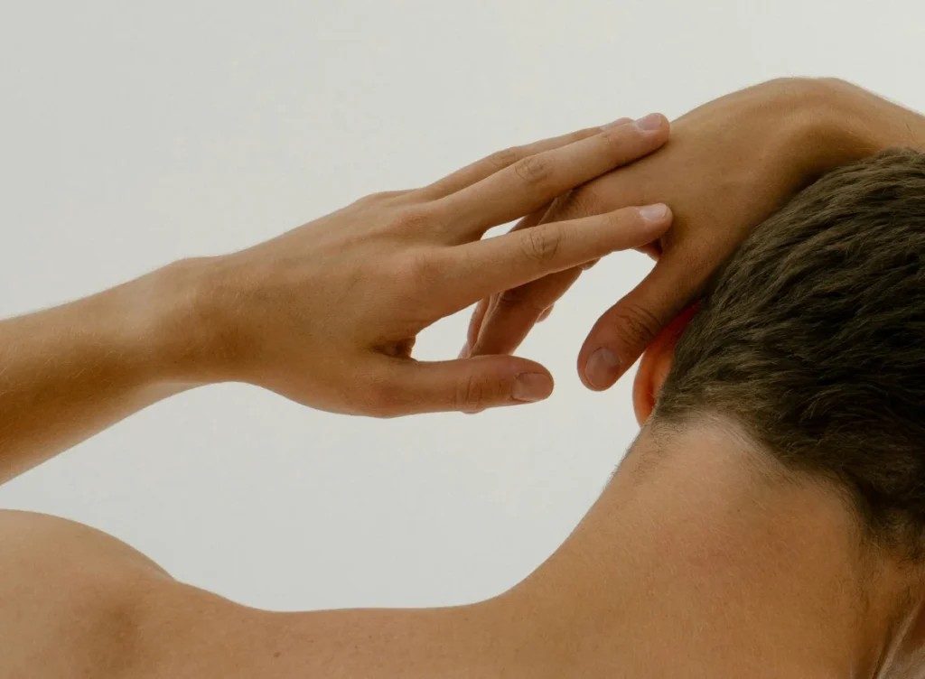 Man stretching his arms to improve flexibility and relieve tension