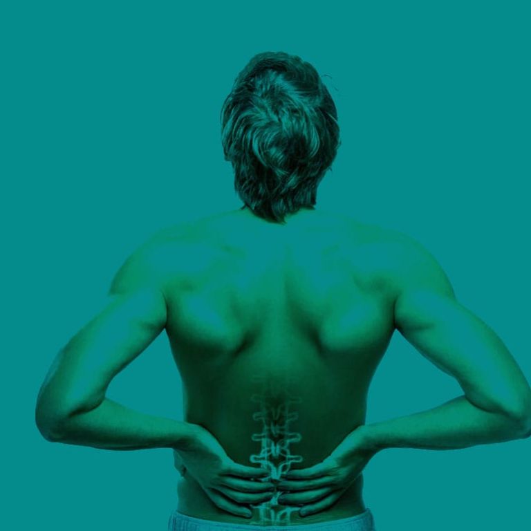 Person with low back pain receiving physiotherapy treatment for pain relief and improved mobility in the UK