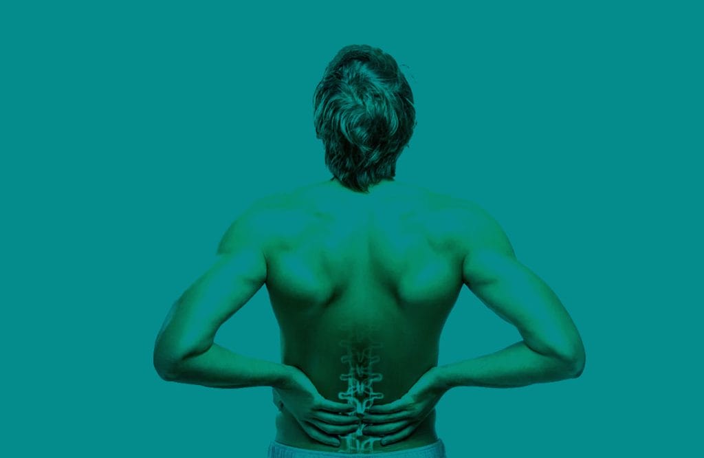 Person with low back pain receiving physiotherapy treatment for pain relief and improved mobility in the UK